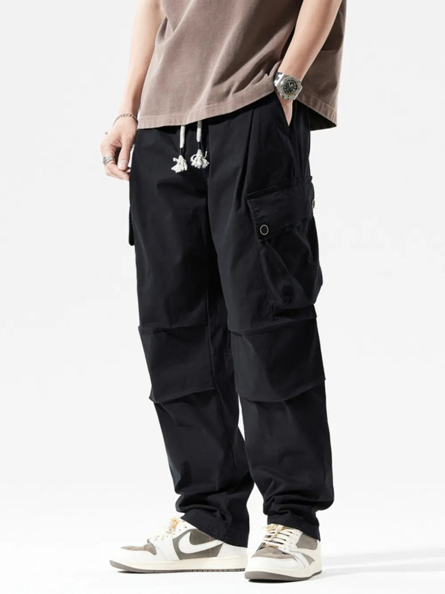 Men's black cargo sweatpants with drawstring and multiple pockets.