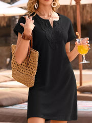 Black waffle knit dress with lace neckline detail and short sleeves.