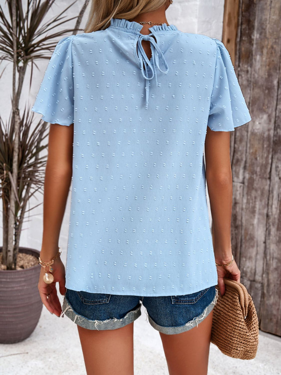 Light blue dotted swiss smocked bodice flutter sleeve top with tie back
