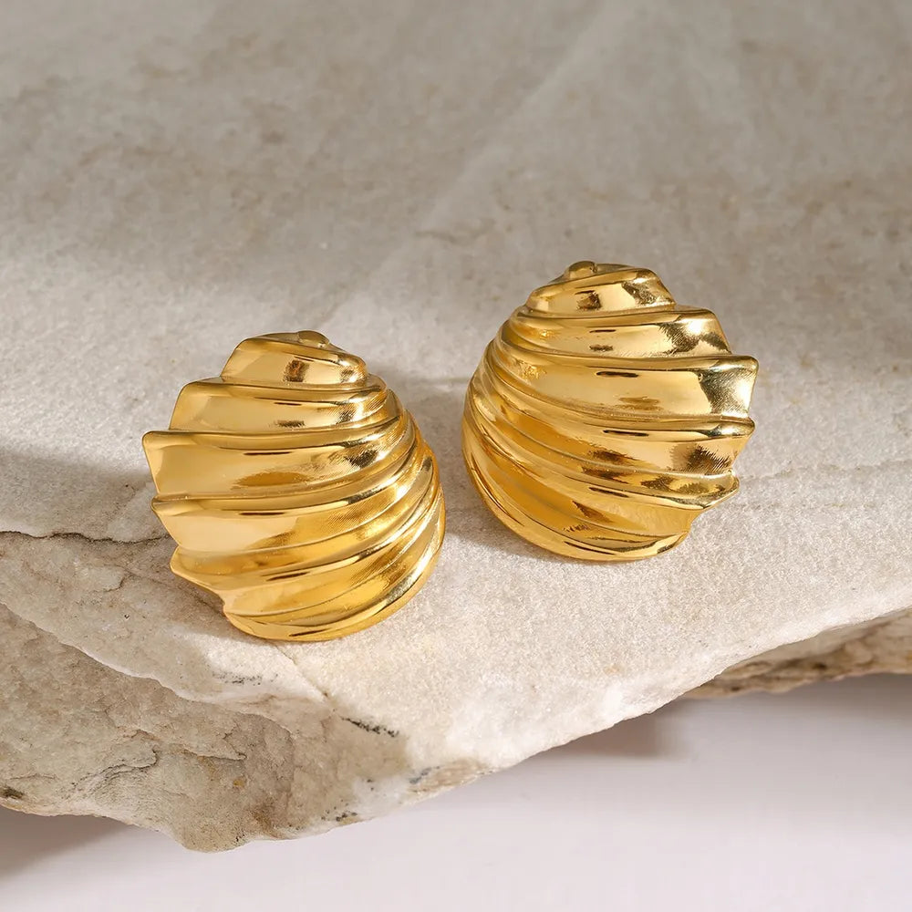 Sculpted spiral gold stud earrings with 18K gold plating and a textured finish.