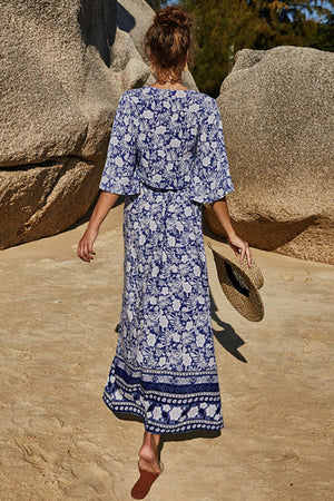 Dark blue floral print viscose maxi skirt with tiered hem detail.