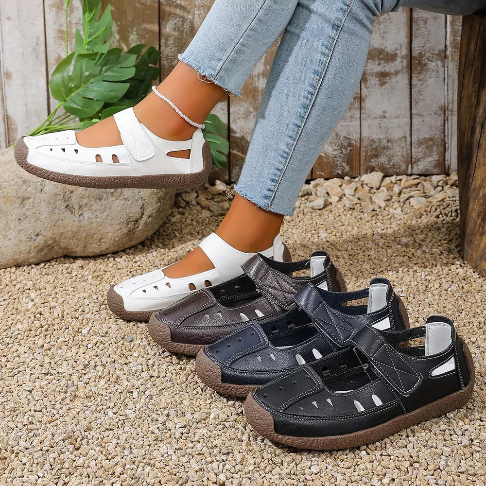 Classic round toe platform flats with adjustable strap and cutouts in black, brown, and blue.