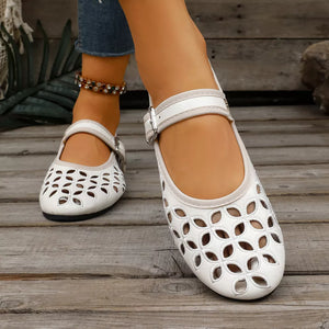 flats in Silver with floral and round toe