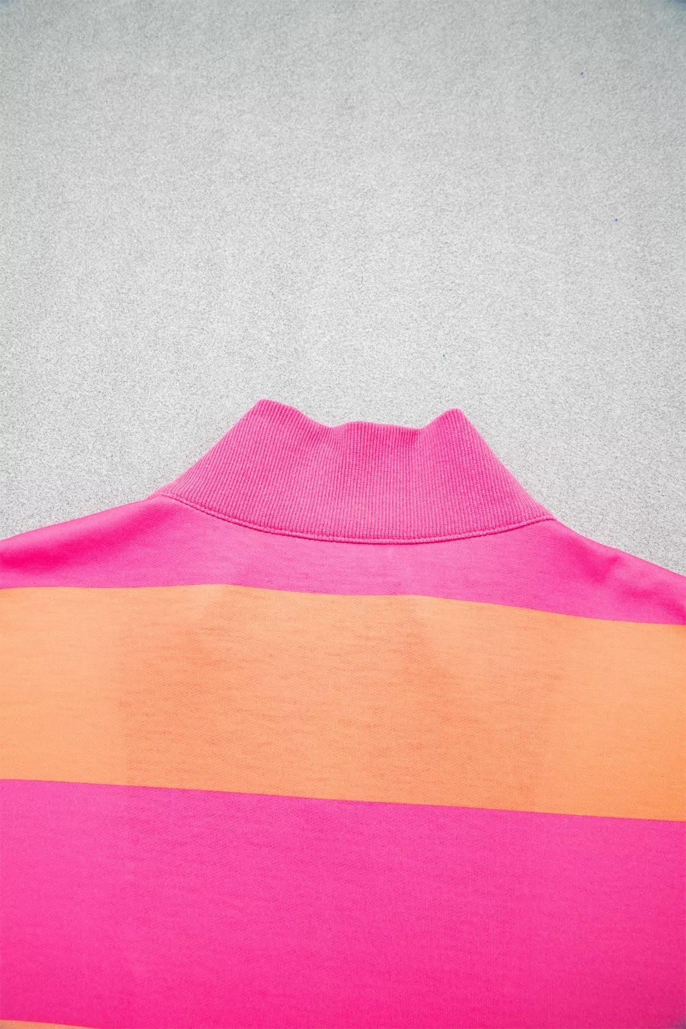 Two-piece set with vibrant pink and orange stripes and a ribbed mock neck collar.
