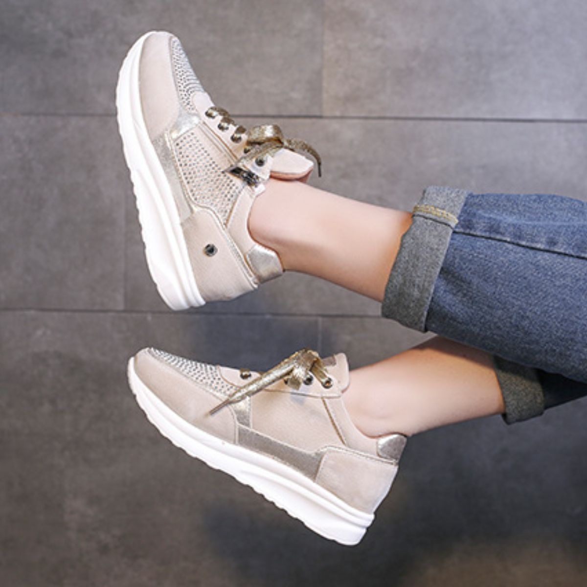 Khaki lace-up sneakers with rhinestone embellishments and a chunky sole.