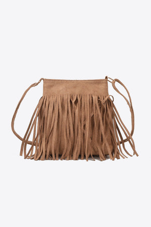 Caramel suede crossbody bag with fringe detail and adjustable strap