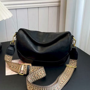 Black vintage wide strap crossbody bag with adjustable patterned strap