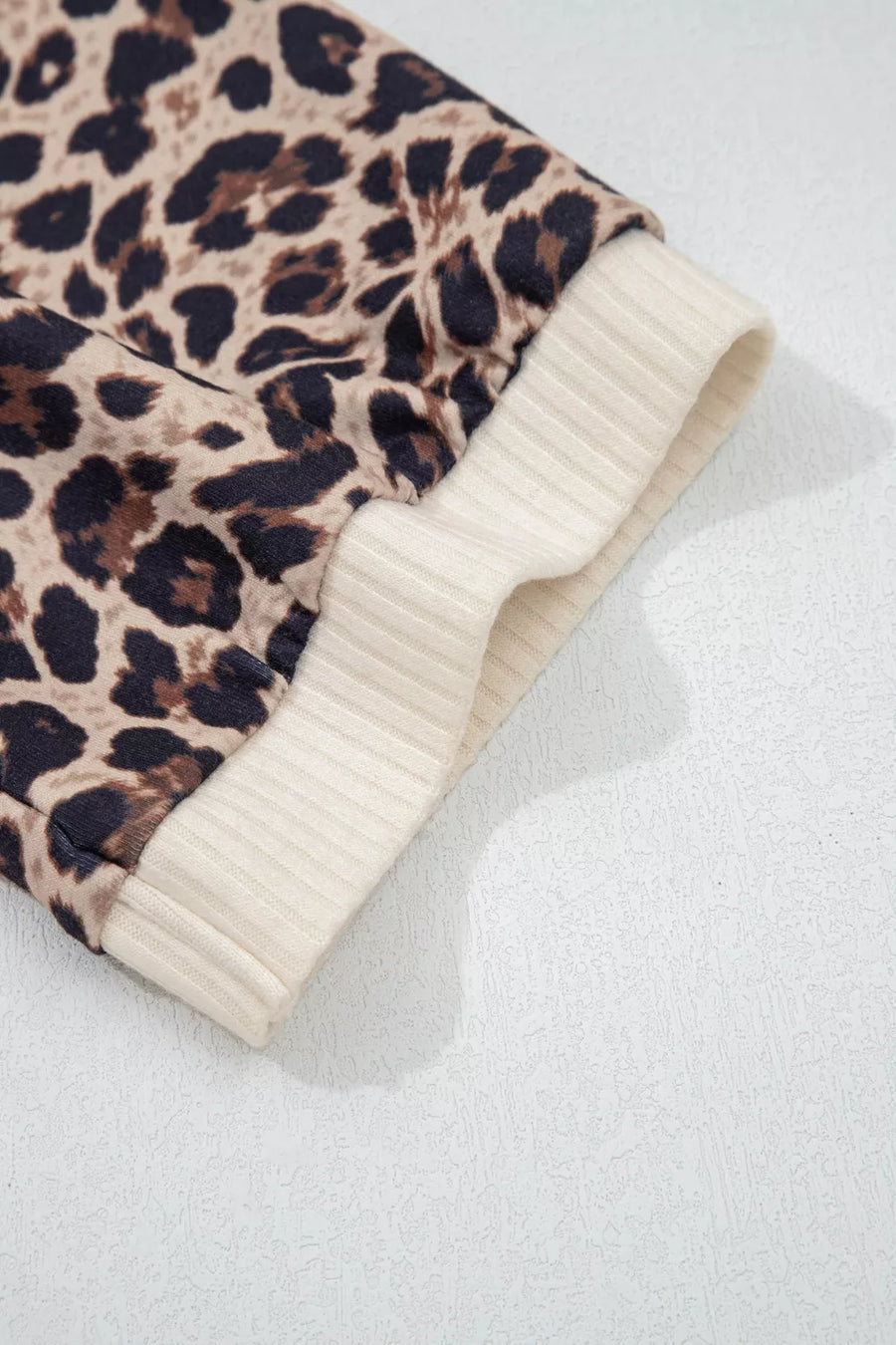 Ribbed leopard print shirt cuff with cream contrast trim
