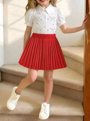 Girls red pleated skirt and white bow-embellished top duo