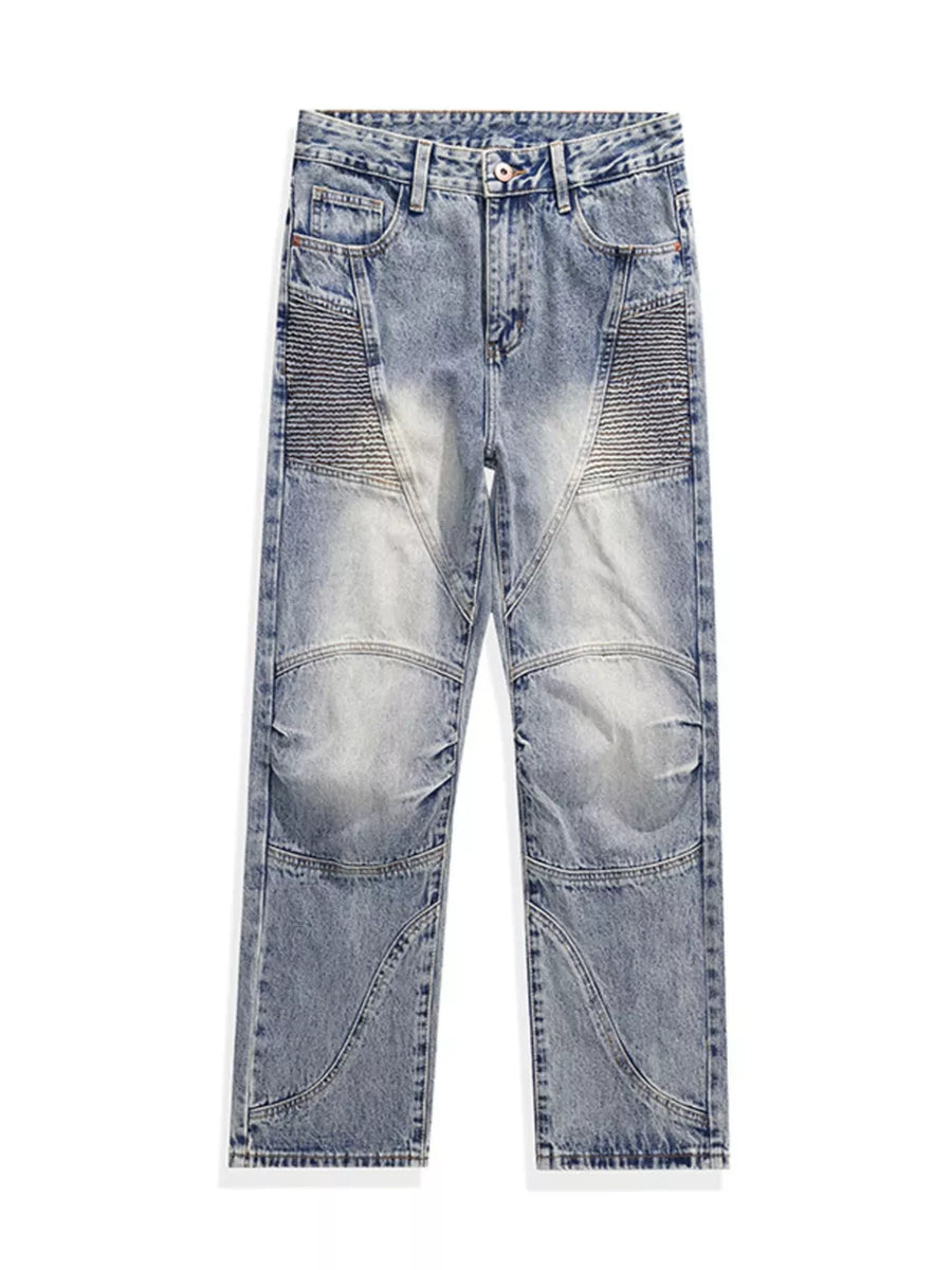 Men's light wash wide-leg jeans with moto-inspired paneling and ribbed detailing.