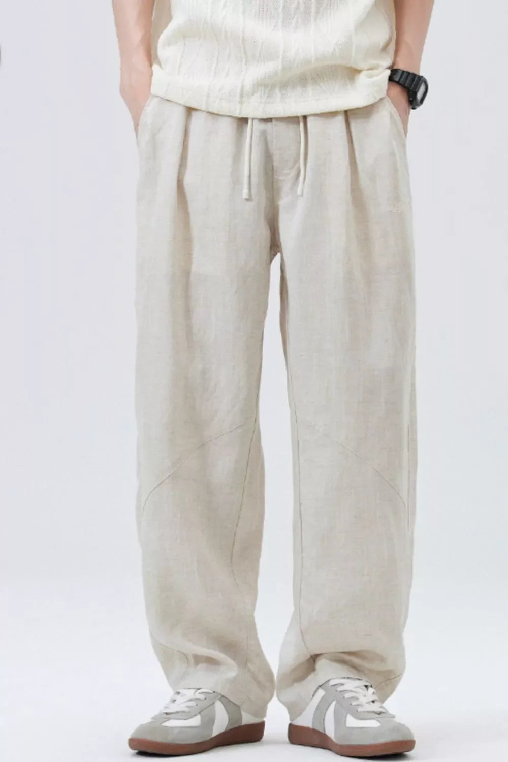 Loose fit drawstring casual pants in apricot with a relaxed cut and subtle seam details.