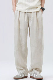 Loose fit drawstring casual pants in apricot with a relaxed cut and subtle seam details.