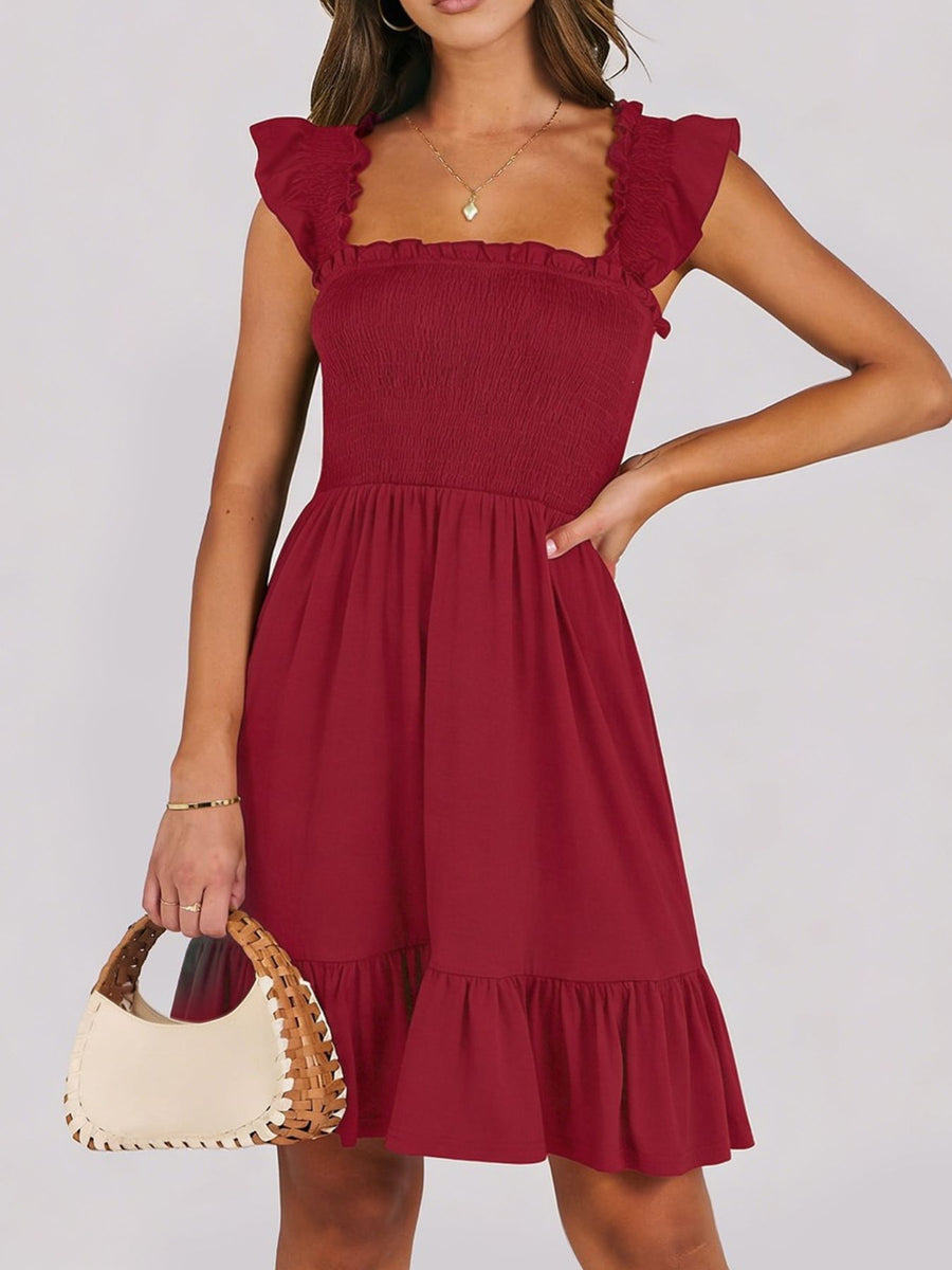 Burgundy smocked mini dress with ruffle hem and square neckline.