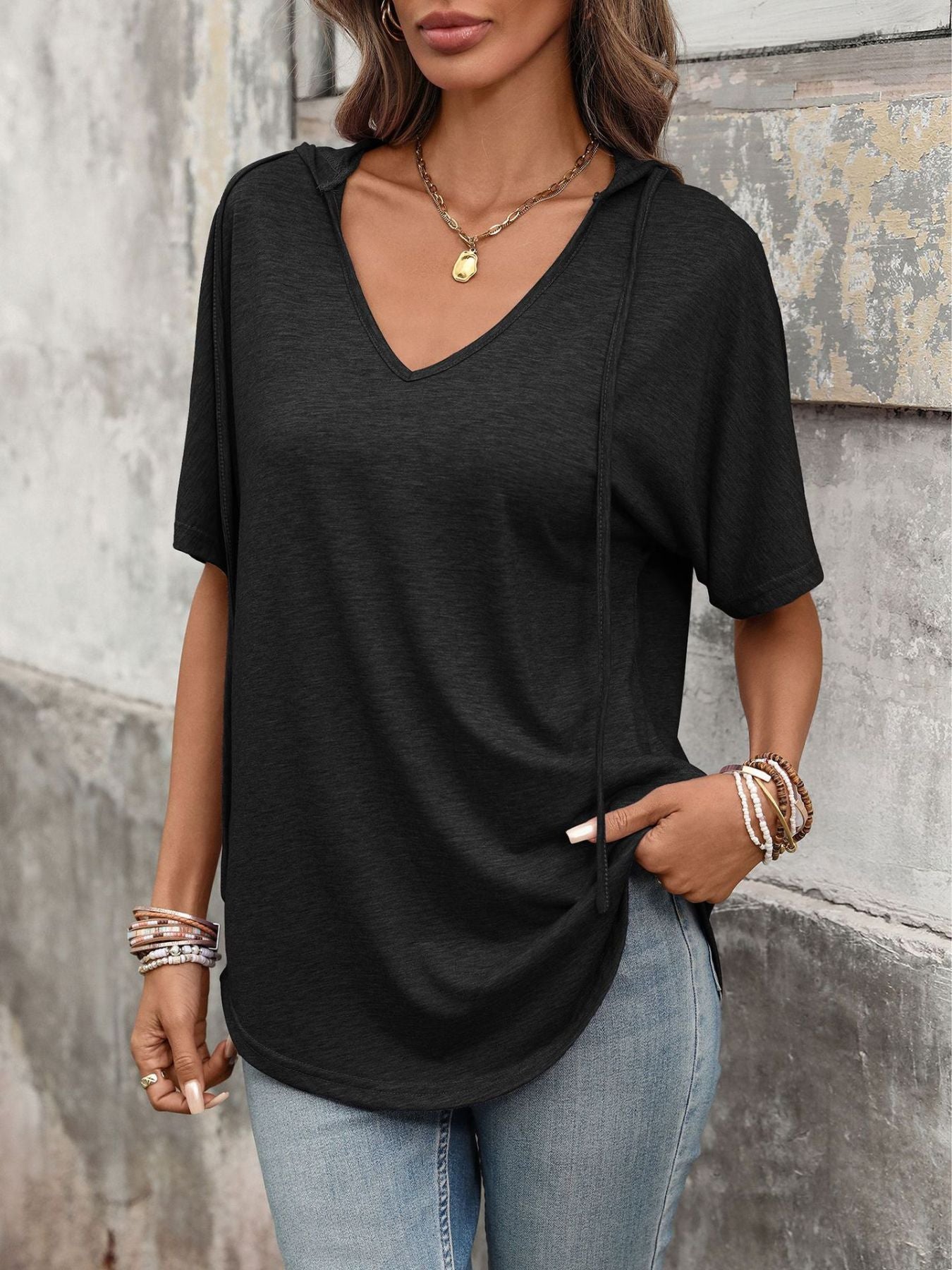 Black hooded t-shirt with short sleeves, V-neck, and drawstring detail.