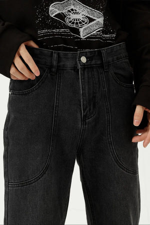 Black denim straight leg jeans with curved panel seams and front pockets.
