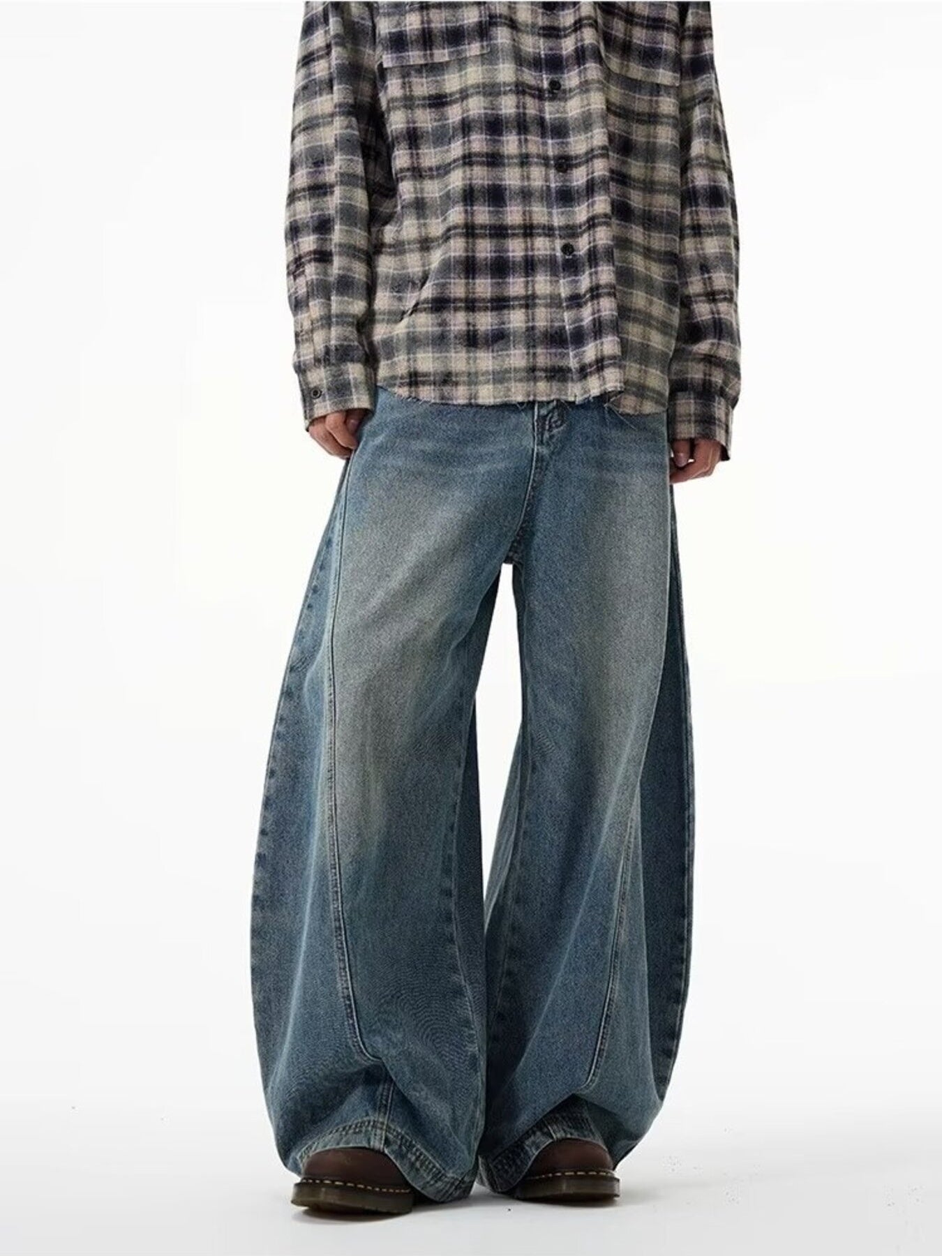 Men's blue cotton wide leg jeans with a baggy fit.