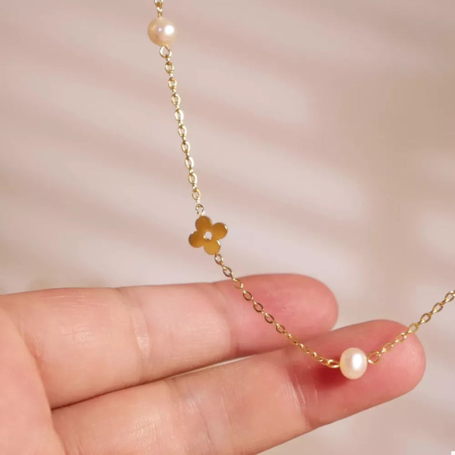 gold necklace with pearl accents and N/A