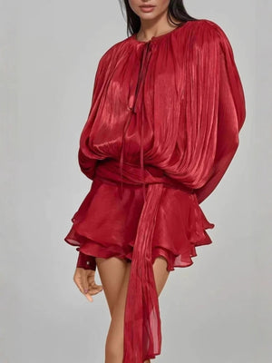 Red two-piece set with tied balloon sleeves and tiered ruffled skirt.