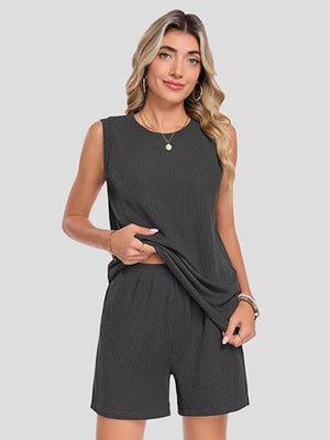 Sleek ribbed knit set in black with sleeveless top and pocketed shorts.