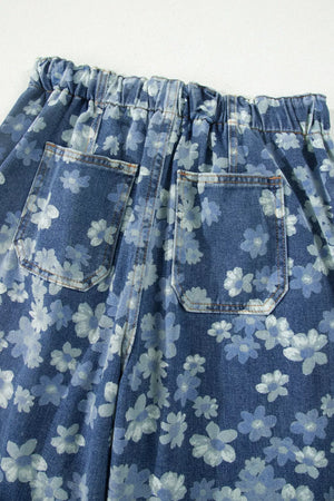 Blue floral denim barrel jeans with pockets and drawstring waist.