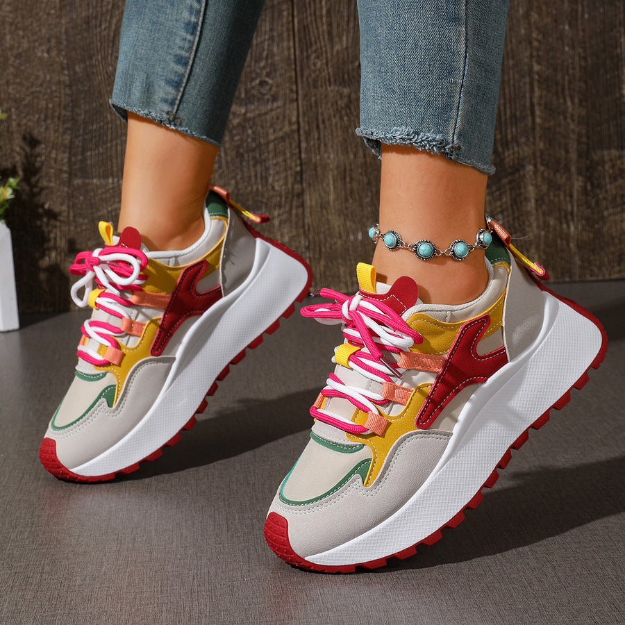 red sneakers featuring round toe and color-block