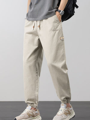 joggers in khaki featuring drawstring and tapered fit