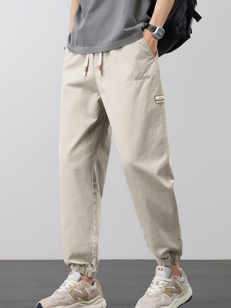 joggers in khaki featuring drawstring and tapered fit
