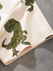 Cream cotton tee with allover green geometric dinosaur print.