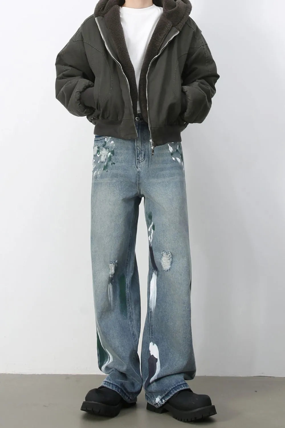 Ink-Blot Wide Leg Denim jeans in medium wash with abstract paint splatters and distressed details.