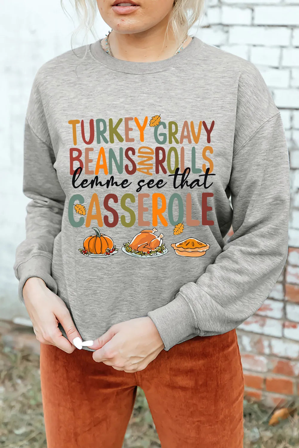 Gray graphic sweatshirt with Thanksgiving food print and text.