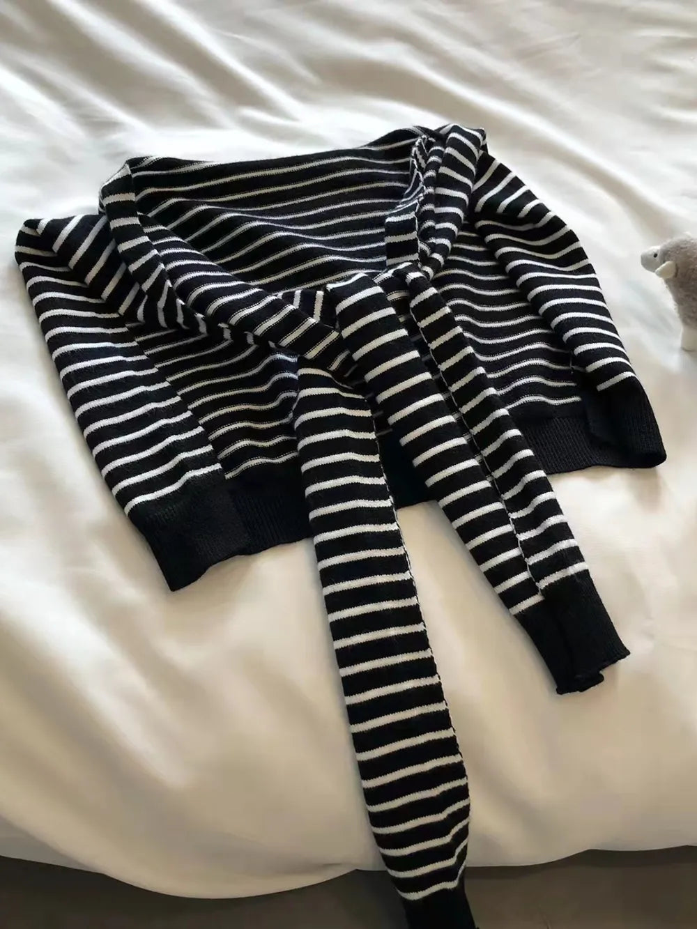Black and white striped acrylic sweater with tie-front detail
