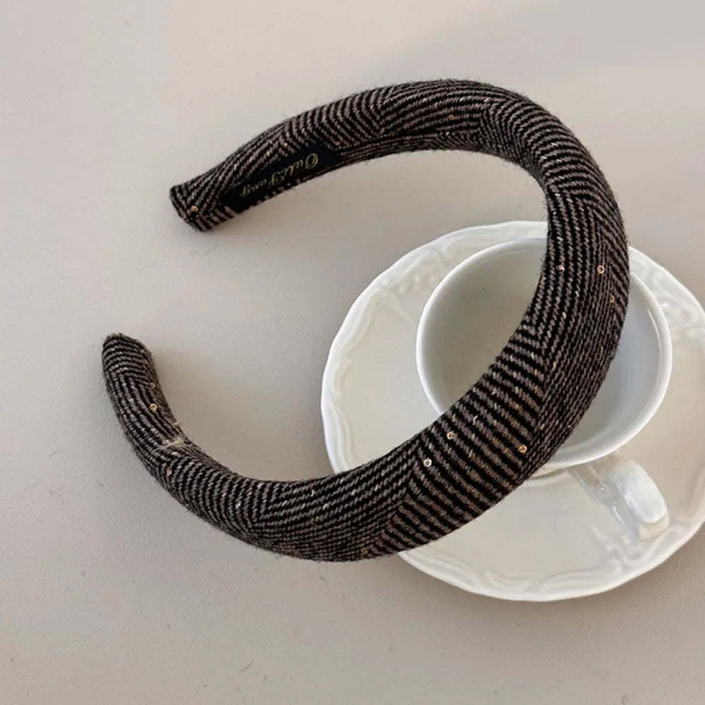 Textured tweed padded headband in coffee brown with subtle sequins and herringbone pattern.