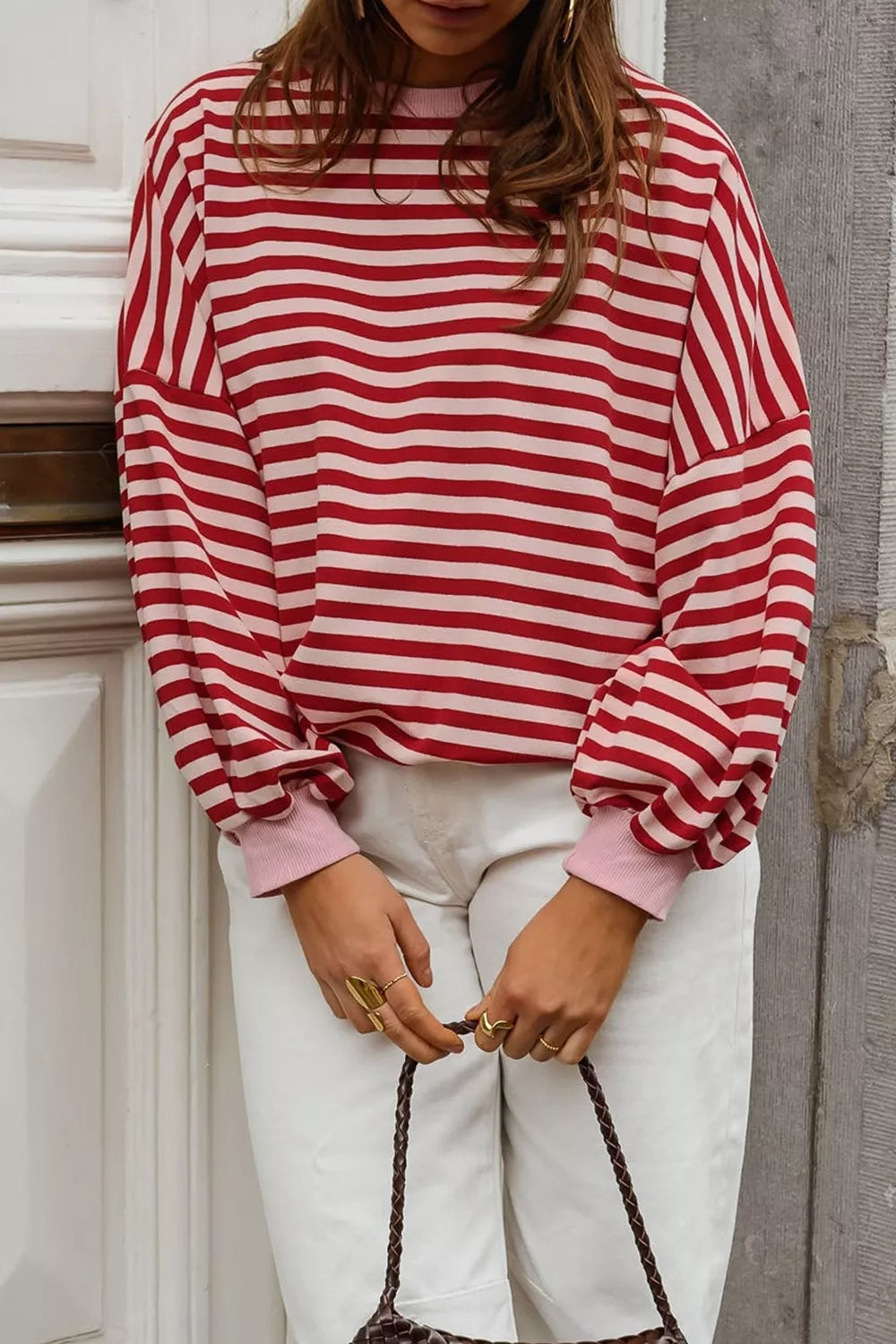 light pink sweatshirt featuring cutout back and striped