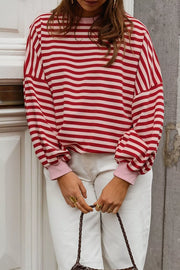 light pink sweatshirt featuring cutout back and striped