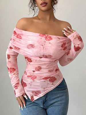 Pink ruched off-shoulder mesh top with a floral print and asymmetrical hem.