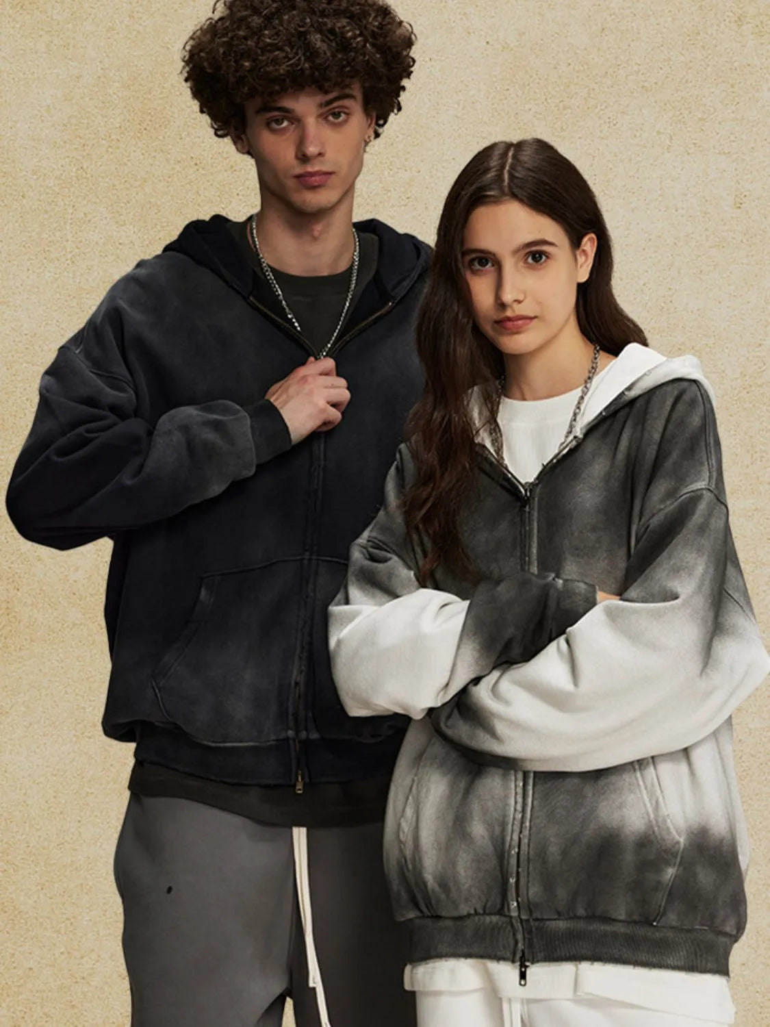 Ombre washed zip-up hoodie with a faded black to white gradient, featuring a relaxed fit and front pockets.