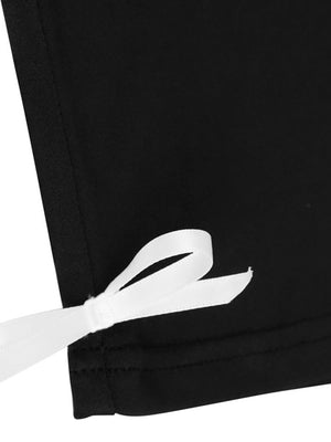 Black capri romper with white lace trim tie detail