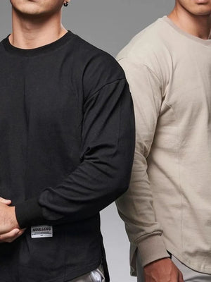 Oversized long sleeve tee in black with curved hem and crew neck.