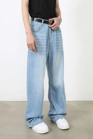 Light blue oversized denim palazzo jeans with a relaxed fit and subtle horizontal fading.