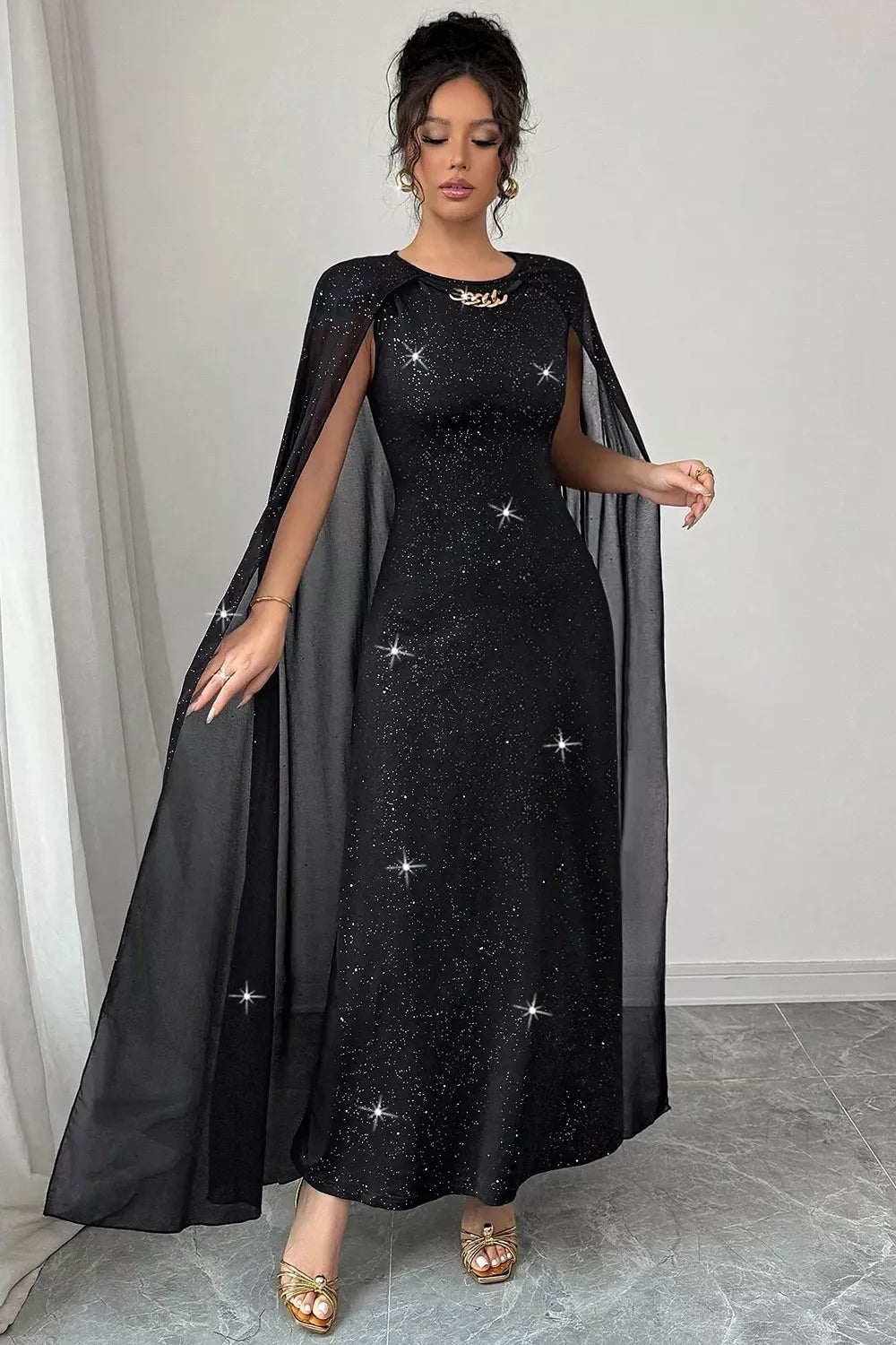 black maxi dress with stretch and cape sleeve
