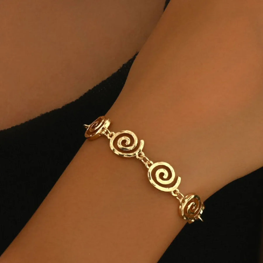 Gold jewelry set featuring 18K gold-plated and spiral