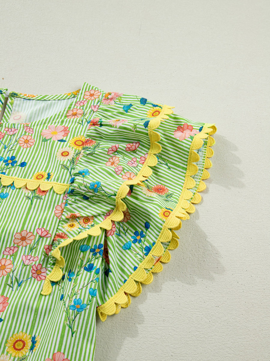 Green striped cotton blouse with floral print, ruffle short sleeves, and yellow scalloped trim.