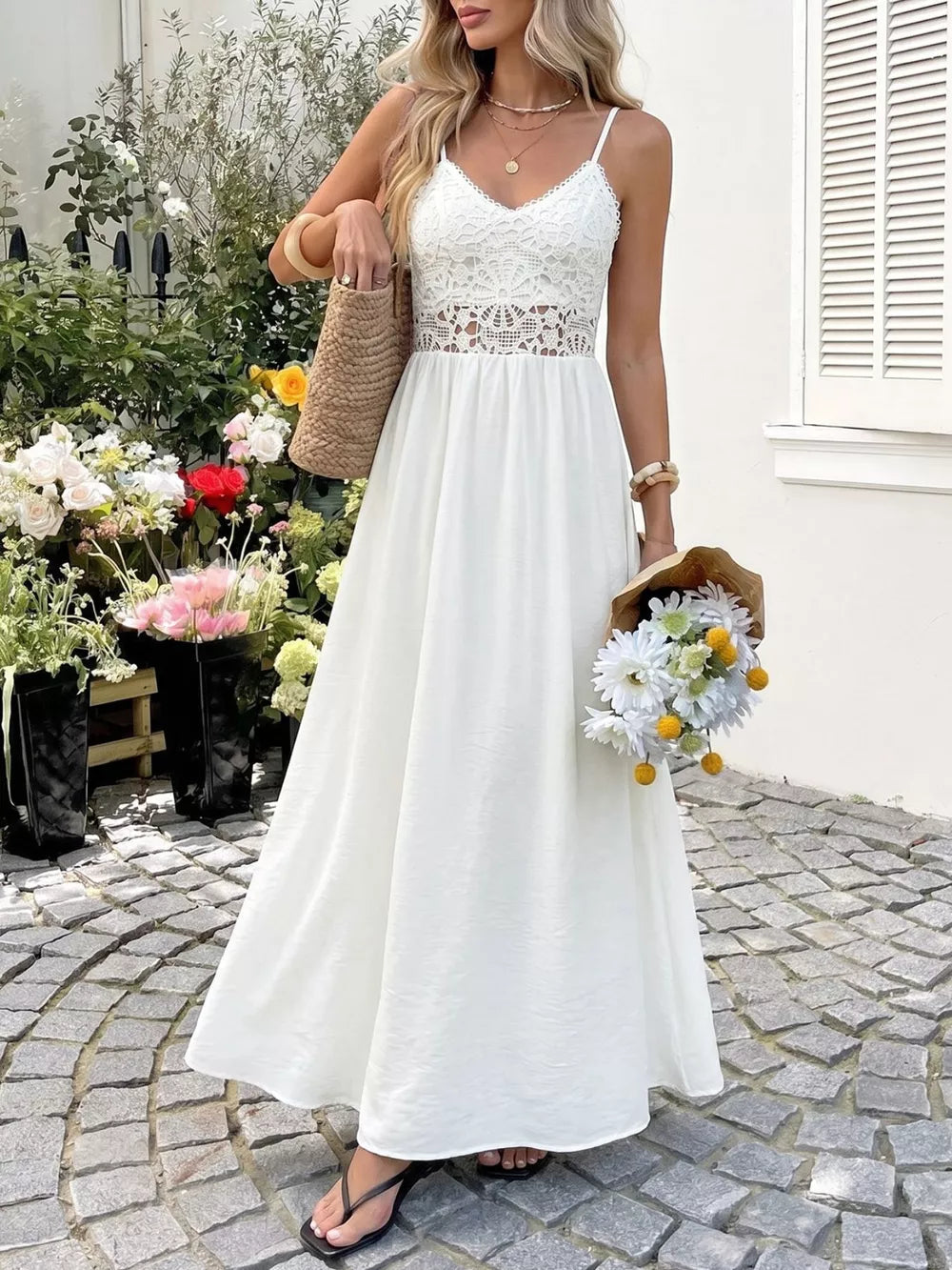 White lace-detail V-neck maxi dress with cutout waist and spaghetti straps.