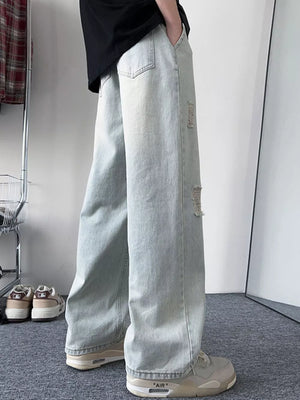 Light blue distressed wide-leg jeans with a relaxed fit.
