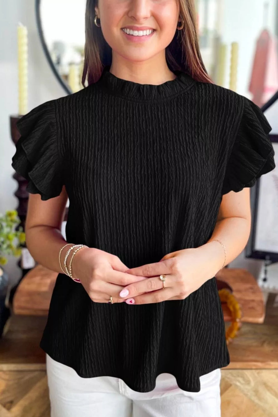 Black textured maternity shirt with frilled ruffle sleeves and mock neck