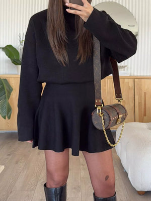 Black turtleneck sweater and flared mini skirt outfit set, casual autumn style.
