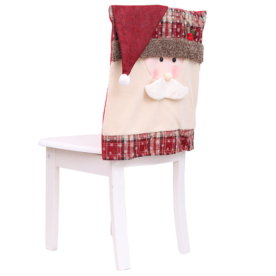 Festive Santa chair cover with plaid trim and plush details for Christmas dining decor.