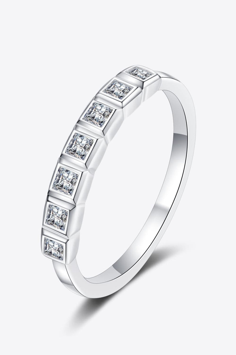 Silver band ring with princess-cut diamonds in square settings