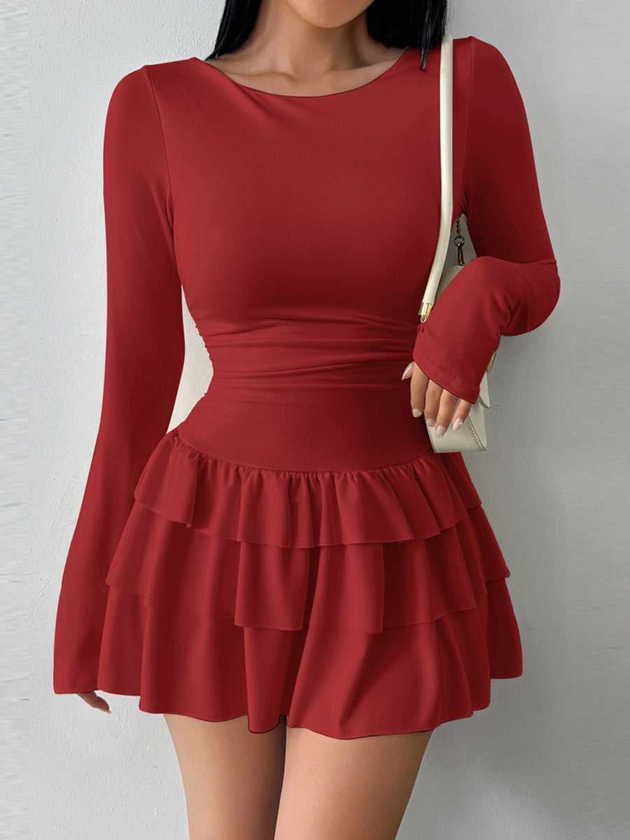 Red tiered ruffle hem mini dress with long sleeves and a scoop neckline.