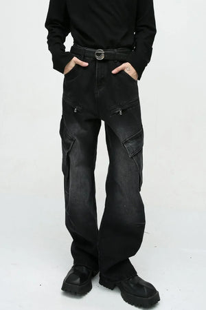 Baggy black denim cargo pants with zipper pockets and large side pockets.